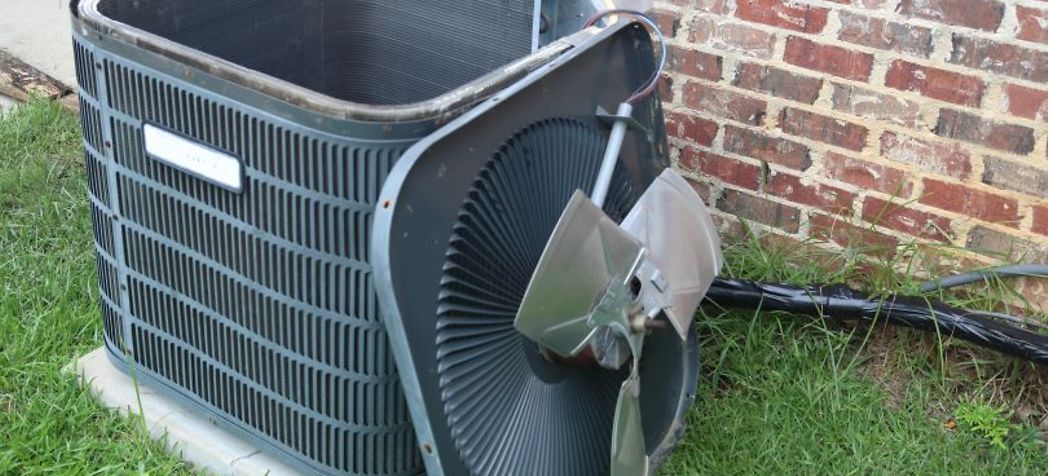 Air conditioner with the top off - Home Air Conditioner Maintenance Tips