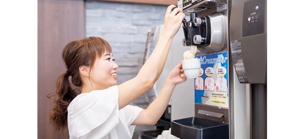 Woman dispensing ice cream - How to use a Crathco Soft-Serve Ice Cream Machine