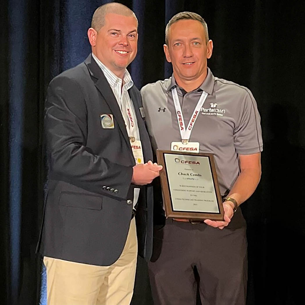 Chuck Combs receiving plaque
