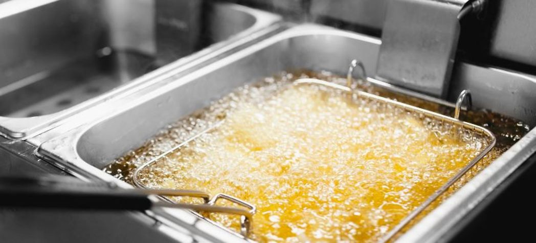 fryer with bubbling oil - what do restaurants use for deep frying