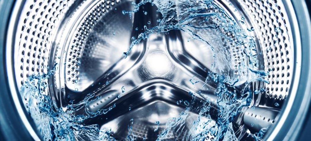 Interior of a washing machine with water splashing - Whirlpool washing machine troubleshooting
