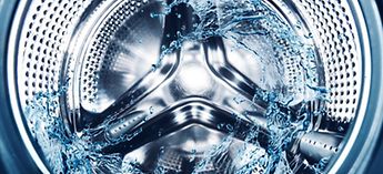 Interior of a washing machine with water splashing - Whirlpool washing machine troubleshooting