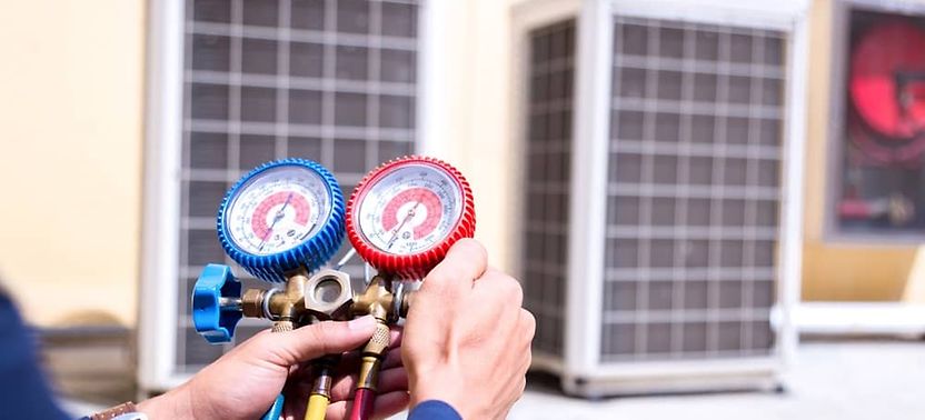 Technician using a pressure gauge - Your complete HVAC technician tool list