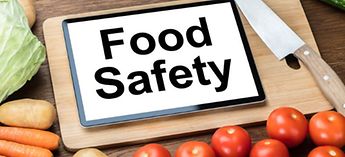 Food safety on a tablet surrounded by veggies - Best Practices for Maintaining Food Safety