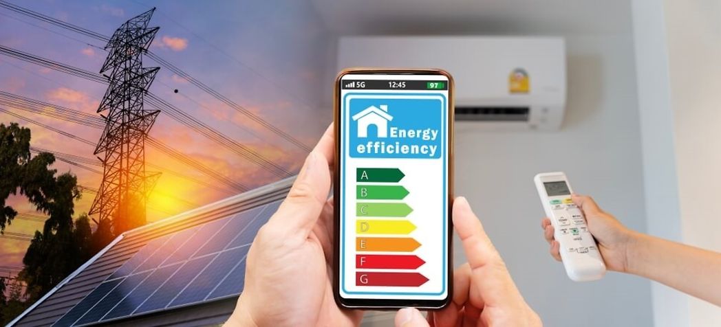 Person programming their air conditioner to be more energy efficient - How much do energy efficient air conditioners save?
