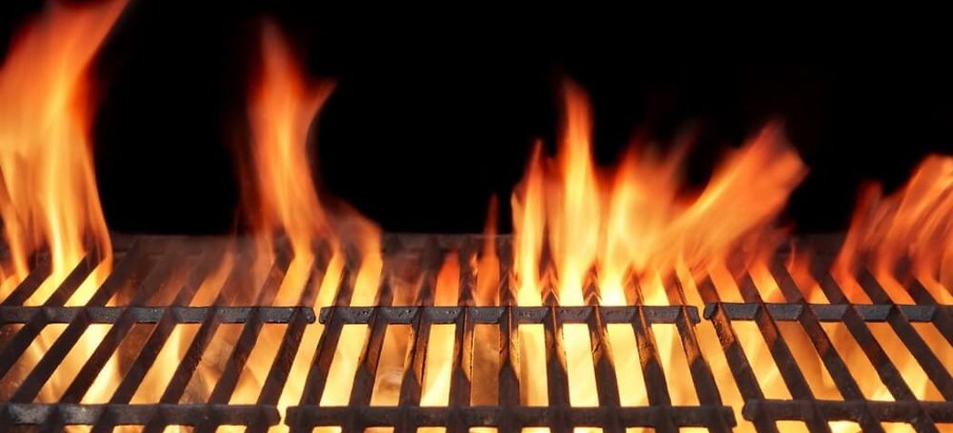Flames licking through charbroiler grates - Bakers Pride charbroiler cleaning 