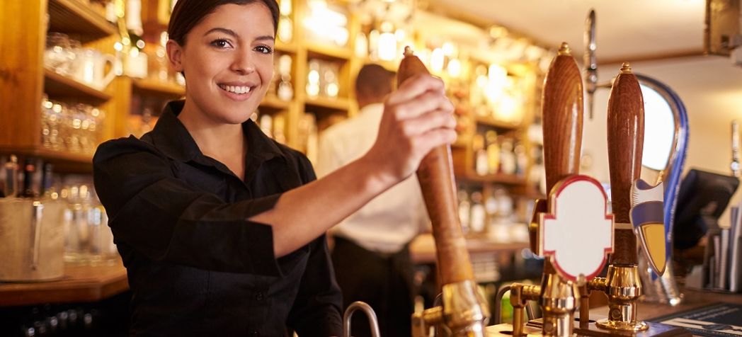 Why Should You Clean Draft Beer Lines - Bartender Pouring Beer
