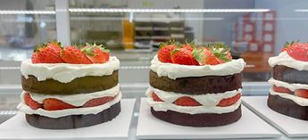 Chocolate cake with strawberries in a display case - Hussmann serial number lookup