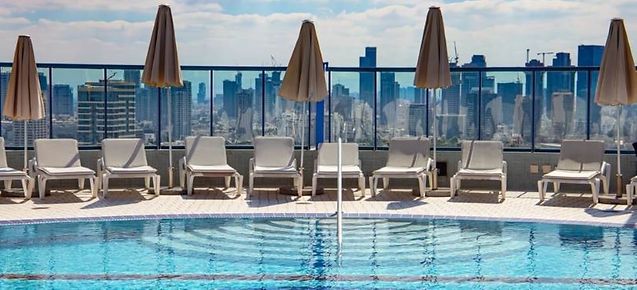 Commercial rooftop pool - Raypak pool heater cleaning