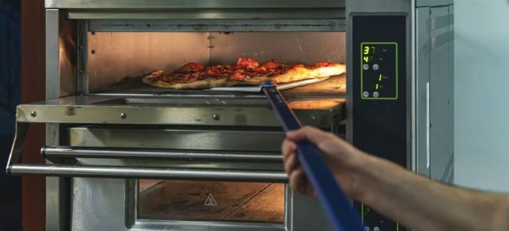 Commercial pizza oven with a pizza going in - Blodgett pizza oven error codes