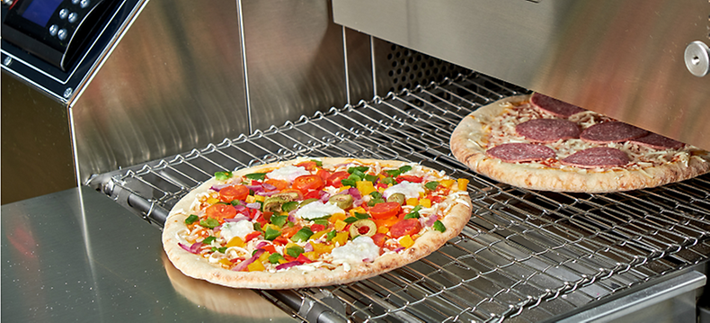 Commercial Pizza Oven Cleaning Guide - Pizza oven with pizzas