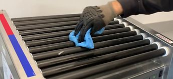 Image - Cleaning a Hot Dog Roller Grill